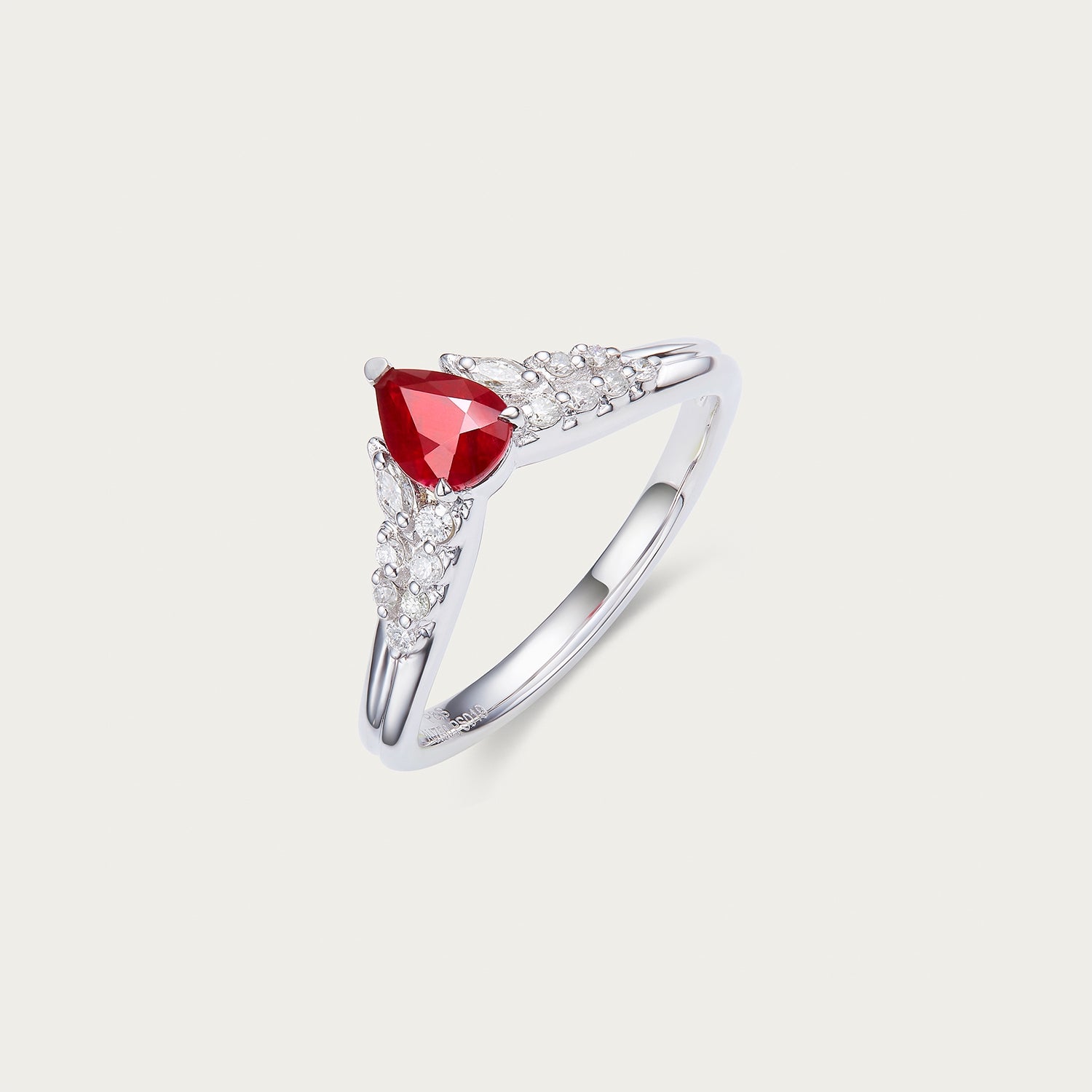 Side detail of unheated ruby center stone in Ember Wing ring