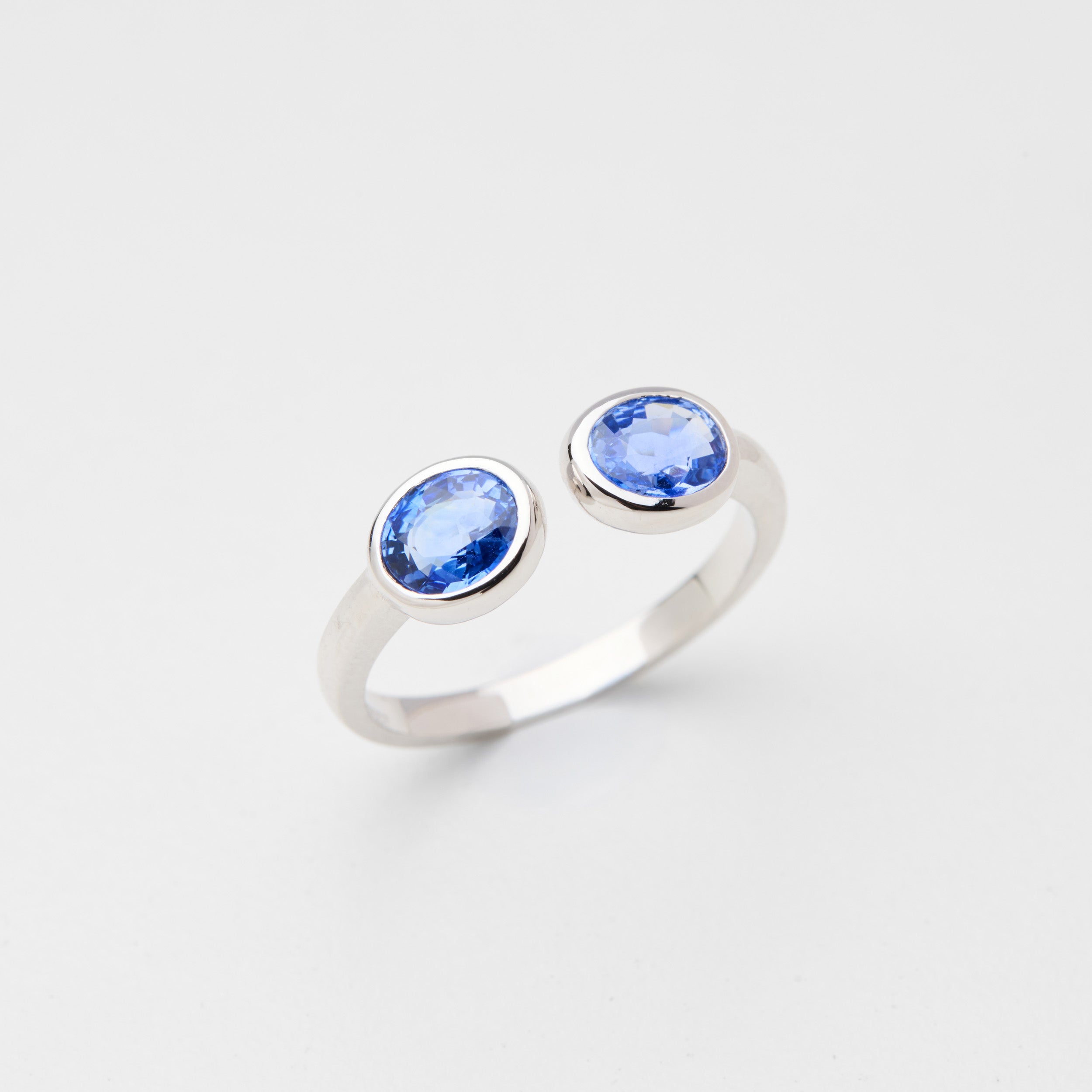 Detail view of dual cornflower blue sapphires in Infinity Duo ring