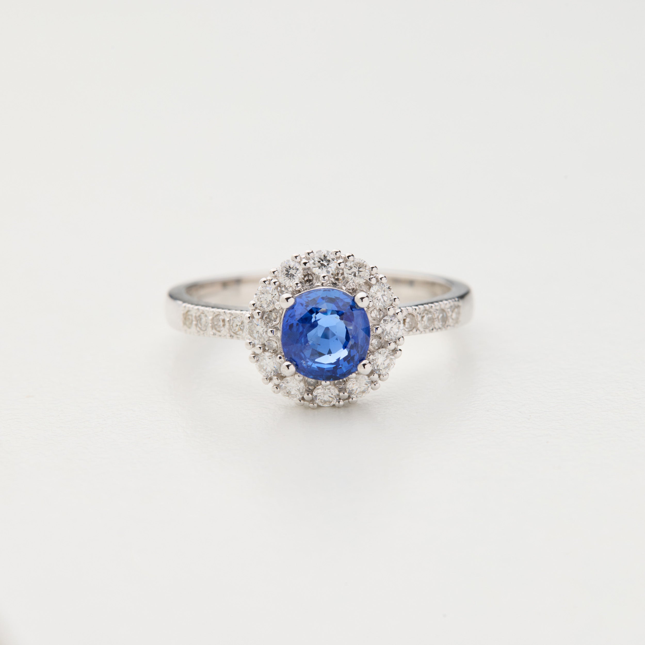 Galaxy Light ring with unheated cornflower blue sapphire and diamond halo in 18K white gold